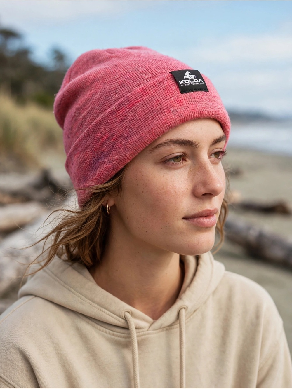 LKOLOA Surf Company Slouchy Beanie in a heathered pink / raspberry color